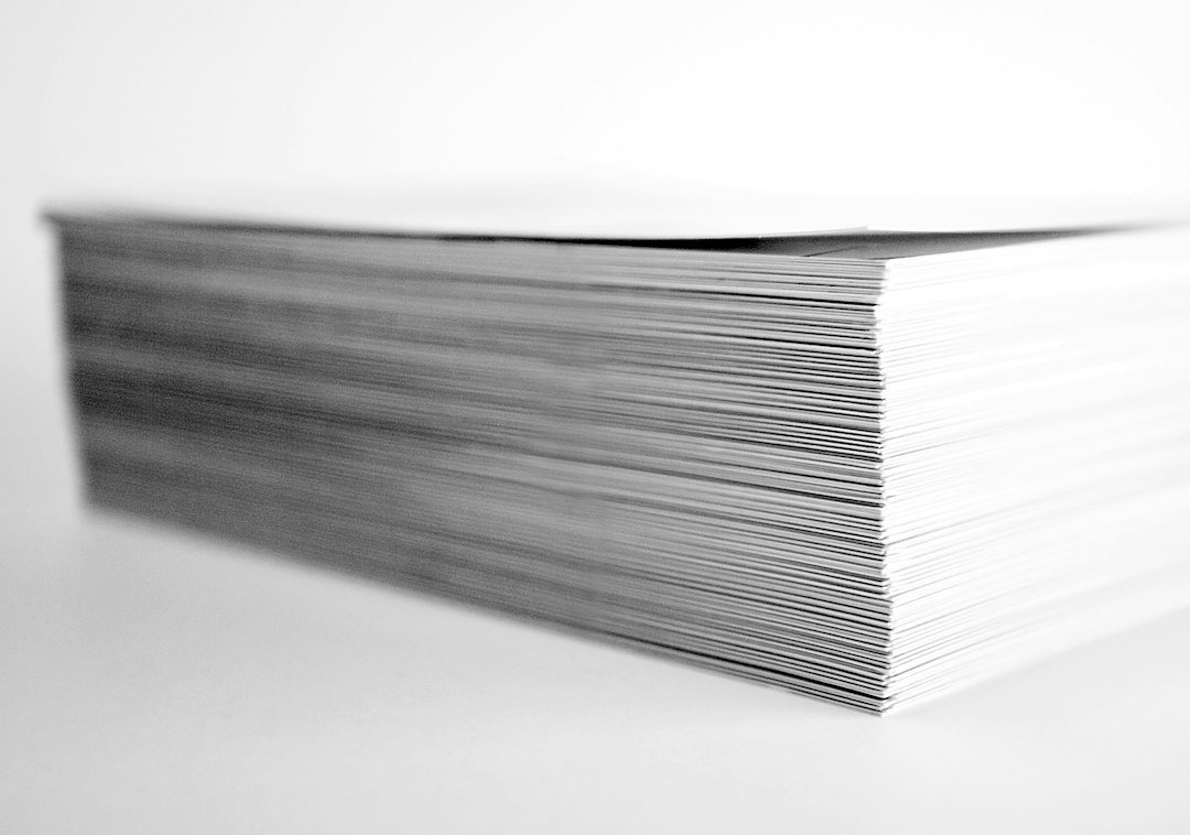 Printed document pages illustrating margins before cropping a PDF