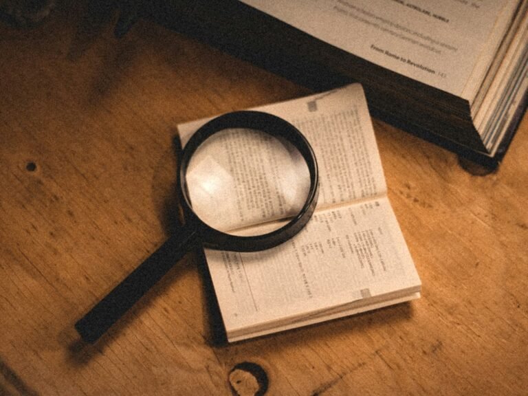 Magnifying glass over printed text representing search and OCR in a scanned PDF